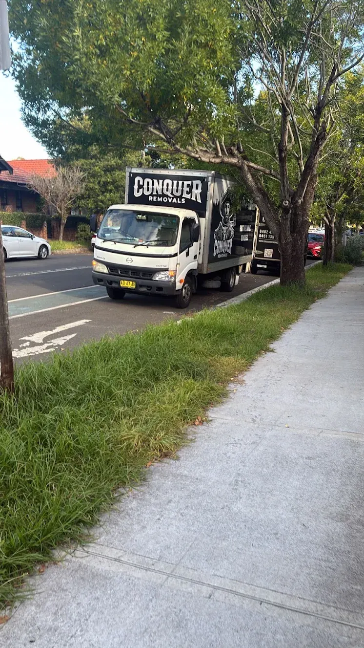 The Conquer Removals truck parked on a Sydney street